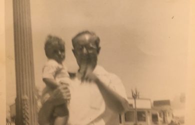 Nan in the arms of her grandfather